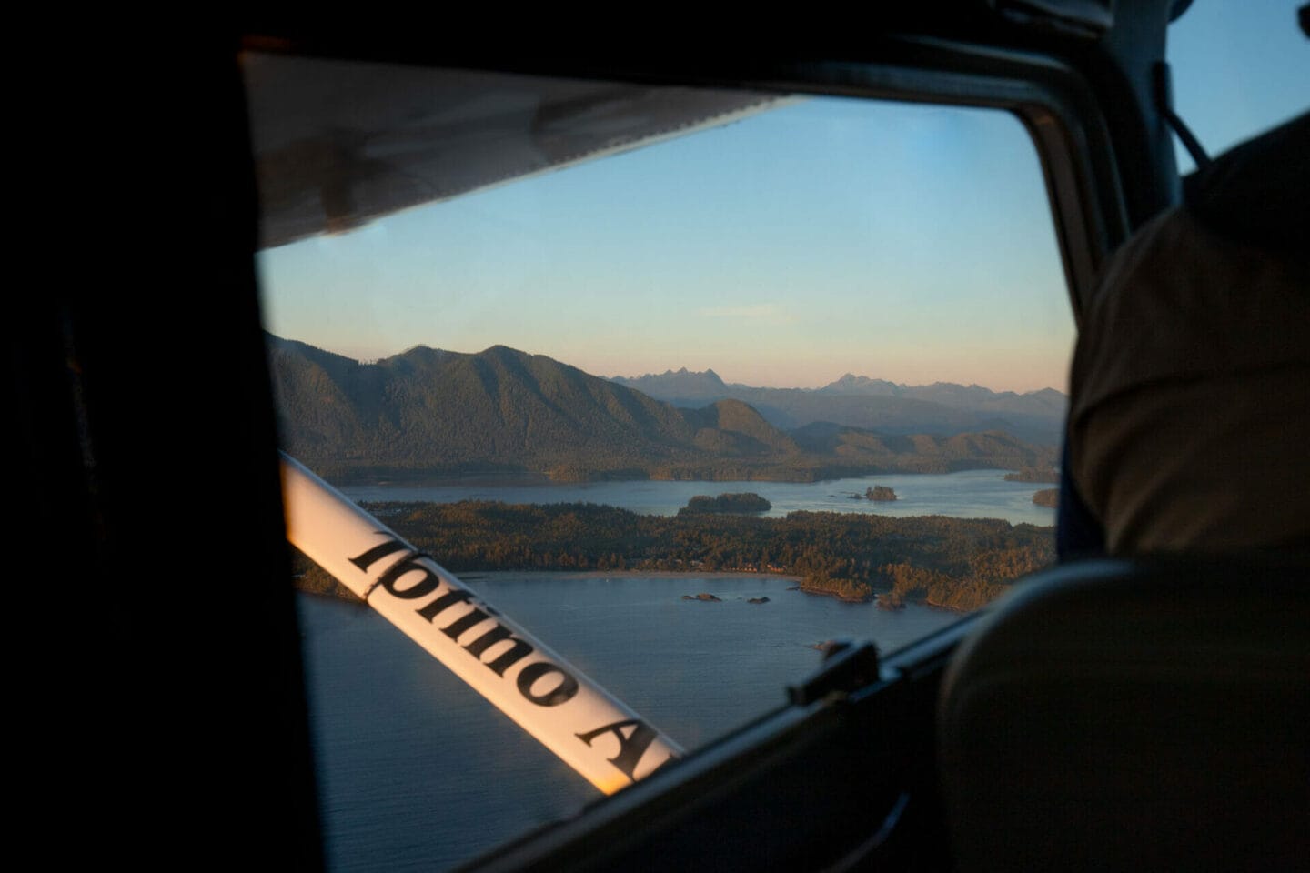 Book a seaplane tour at sunset when visiting Tofino